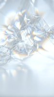 Abstract crystal fragments with rainbow light reflections creating prismatic effects on soft white background for luxury design projects.