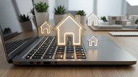 Real estate technology concept with glowing house icons on laptop keyboard for property search and online home buying services.