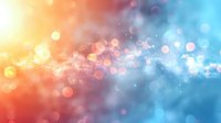 Abstract colorful bokeh background with magical light particles flowing from warm orange to cool blue tones, perfect for festive designs and dreamy overlays.