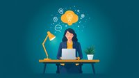 Young Asian businesswoman working at desk with laptop, desk lamp and creative thinking cloud with business icons floating above. Suitable for business concepts.