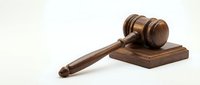 Wooden judge gavel and sound block on white background, legal system symbol for courtroom proceedings, law enforcement and judicial decisions.