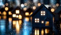 Glowing miniature house silhouette against blurred bokeh lights reflecting on water surface creates magical evening atmosphere. Cozy home concept.