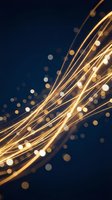 Golden light streaks with bokeh effects on dark blue background creating dynamic energy flow for technology and innovation concepts.