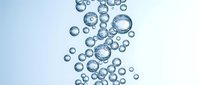 Clear water bubbles rising through liquid creating refreshing aquatic pattern for beverage and wellness designs.