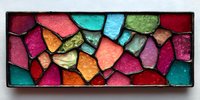 Vibrant mosaic of colorful stained glass fragments in rectangular frame, featuring pink, blue, green, orange, and red pieces creating abstract pattern.