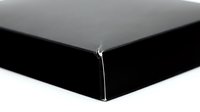 Black fitted bed sheet corner with elastic band on white background isolated for bedding and home textile design.