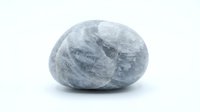 Blue calcite crystal stone with natural marbled patterns isolated on white background for healing meditation and spiritual wellness practices.