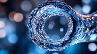 Swirling water vortex with dynamic splash effect and bokeh lights in blue tones creates mesmerizing spiral pattern for backgrounds and creative designs.