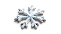 Decorative gingerbread cookie in snowflake shape with white icing glaze on white background, isolated winter holiday sweet treat for festive baking and celebrations.