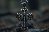 Ornate silver cross pendant with intricate filigree details and embedded crystals hanging on chain against dark blurred background, macro photography closeup.