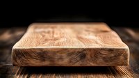 Rustic wooden cutting board with natural wood grain pattern on dark background, macro shot highlighting organic texture and craftsmanship detail.