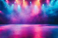 Empty stage with colorful smoke and bright spotlights creating dramatic atmosphere. Pink and blue lighting effects reflect on floor surface. For entertainment backgrounds.