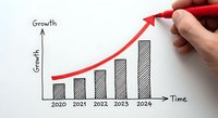Hand drawing red arrow on business growth chart showing upward trend from 2020 to 2024 with bar graph on white paper for financial planning.