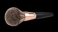 Fluffy powder makeup brush with rose gold ferrule and black handle, isolated on transparent background, ready for beauty clipart, stickers, and print on demand designs.