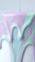 Abstract fluid art with pastel purple and mint green marble swirls creating organic flowing patterns for modern design backgrounds and creative projects.