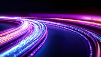 Glowing curved light trails in motion with purple and blue neon colors against dark background create dynamic flowing effect for technology concepts.