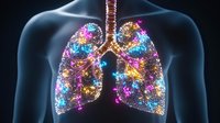 Colorful glowing lungs with sparkles and light effects on dark background, medical visualization showing respiratory system anatomy in vibrant neon colors.