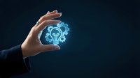 Business hand protecting glowing lightbulb gear icon representing innovation management and creative problem solving in corporate environment.