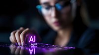 Asian female tech professional interacting with glowing AI symbol on dark reflective surface with purple neon lighting, focusing on artificial intelligence interface.