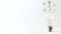 Glowing light bulb with creative innovation icons floating above on clean white background for business concepts and brainstorming presentations.
