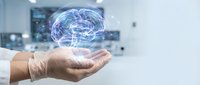Medical professional holding holographic brain model in modern healthcare facility showcasing neurology and artificial intelligence technology.