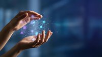 Hands holding glowing digital network globe with connected lines and particles, representing global communication, technology innovation, and data connectivity for business solutions.