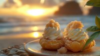 Cream-filled choux pastries with whipped topping and macadamia nuts on white plate against dramatic ocean sunset background. Golden hour dessert photography.