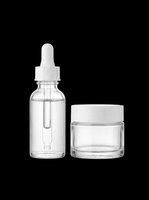 Cosmetic glass bottles with dropper and cream jar isolated on transparent background, ready for skincare product packaging, labels, print-on-demand designs, and sublimation projects.