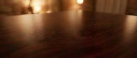 Warm wooden floor with soft golden lighting creating cozy atmosphere for interior design and home decor projects.