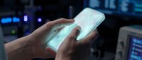 Close-up of hands holding a glowing smartphone with blank white screen in dark tech environment, suitable for app development, technology concepts, and digital innovation projects.