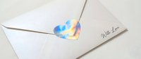 Watercolor heart-shaped wax seal in blue and gold tones on white envelope with twine, perfect for wedding invitations, greeting cards, and stationery design projects.