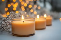 Glowing scented candles with warm bokeh lights and delicate white flowers create cozy atmosphere for meditation, spa, or romantic evening relaxation.