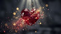 Sparkling red crystal heart exploding with golden particles and light rays on dark background for romantic designs and Valentine's Day concepts.