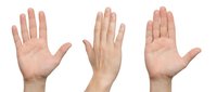 Three open hands showing palms in greeting or stop gesture isolated on white background for design projects and presentations.