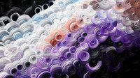 Abstract colorful swirled pattern with circular elements in purple, orange and gray tones creating dynamic flowing texture for modern design backgrounds.