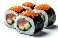 Fresh sushi rolls with tuna, cucumber and red caviar on top, wrapped in nori seaweed and white rice, close up view on white background.