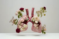 Human lungs adorned with blooming flowers in pink and burgundy tones, symbolizing respiratory health and nature harmony on a light background.