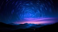 Night sky with circular star trails over mountain landscape creating spiral pattern in deep blue and purple colors for astronomy and nature photography.
