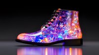 Vibrant galaxy print leather boot with cosmic pattern featuring swirling blues, purples, and pink nebula designs on dark background, illuminated with glowing effect.