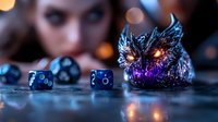 Mystical gaming scene with glowing dragon figurine and blue dice on dark surface, dramatic lighting creates magical atmosphere with bokeh effects in background.