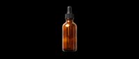 Amber glass dropper bottle with black pipette cap isolated on transparent background, ready for cosmetics, essential oils, serums, and wellness product packaging designs for print-on-demand and sublimation.