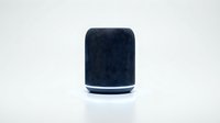Dark navy fabric smart speaker with white accent band isolated on white background, ready for tech product design, web graphics, and marketing materials.