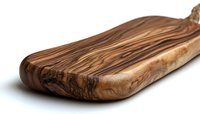 Handcrafted olive wood cutting board with distinctive natural grain pattern and smooth curved edges on white background, isolated for kitchen and dining decor.