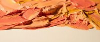 Autumn leaves scattered on white surface creating warm seasonal display with orange red yellow foliage for fall decorating and nature themes.