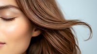 Young woman with flowing brown hair in motion showcasing healthy shiny strands and natural beauty for haircare and wellness concepts.