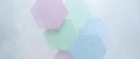 Overlapping translucent hexagons in pastel pink, mint green, and blue tones on white background. Isolated geometric shapes for design, web graphics, and creative projects.