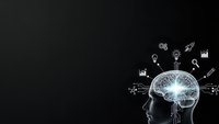 Human head silhouette with glowing brain and business icons on dark background representing innovation, creativity and strategic thinking concepts.
