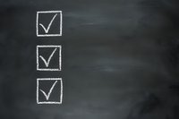 Three white chalk checkmarks in boxes drawn on dark blackboard background, representing completed tasks or successful choices.