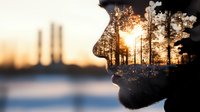 Surreal double exposure portrait combining male silhouette with sunset forest landscape, industrial chimneys in background creating environmental concept art.