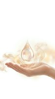 Hand holding glowing water drop with golden light and flowing energy waves for wellness and spiritual healing concepts.